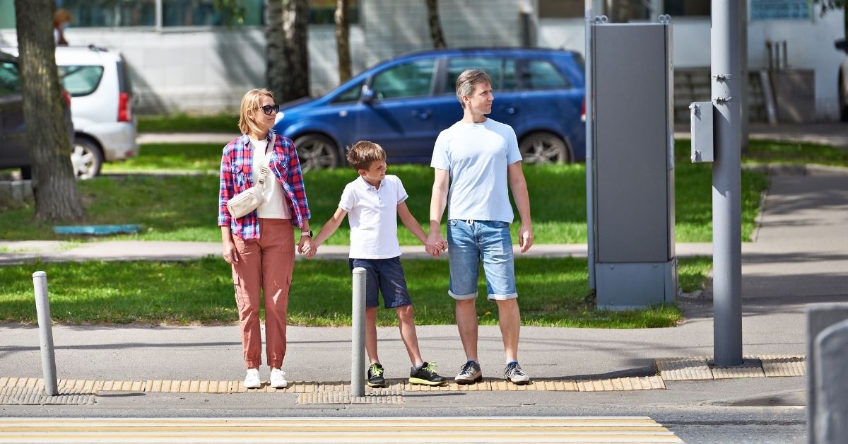 children crossing the pedestrian crossing. teaching children